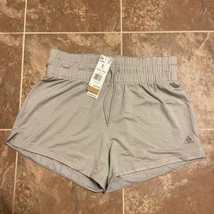 Adidas grey women’s sweat shorts, size large.